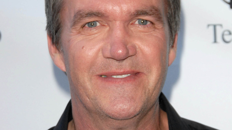 Neil Flynn smiling on red carpet 