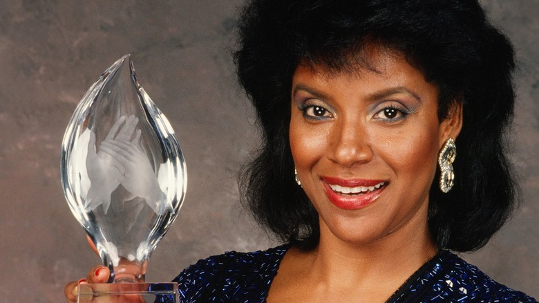 Phylicia Rashad holding an award