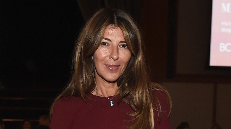 Nina Garcia in a burgundy top