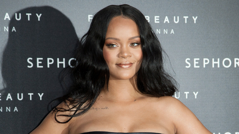 Rihanna smiles on the red carpet