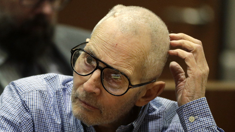 Robert Durst scratching his head