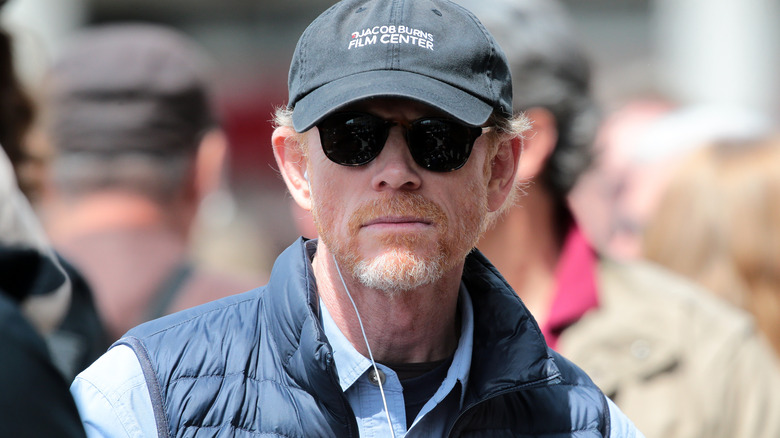 Ron Howard in crowd wearing sunglasses and hat