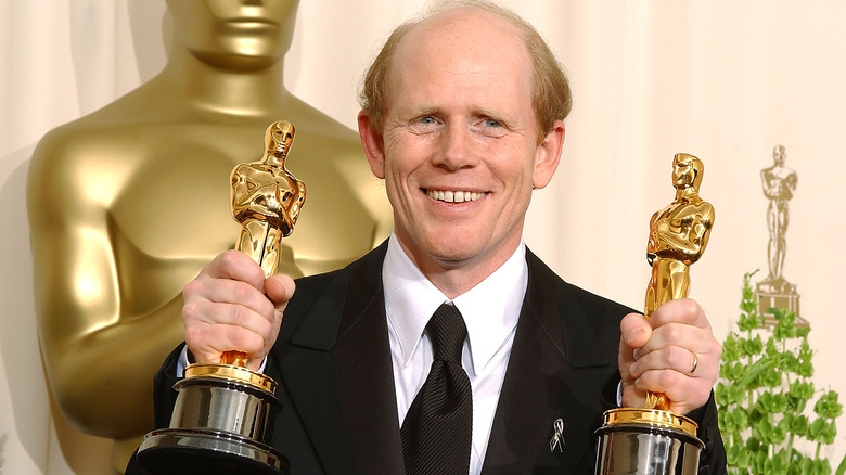 Ron Howard holding his Oscars