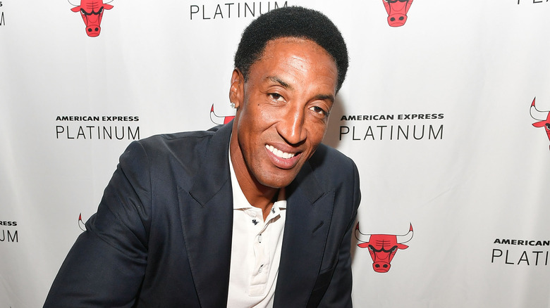 Scottie Pippen posing in front of a Chicago Bulls step-and-repeat