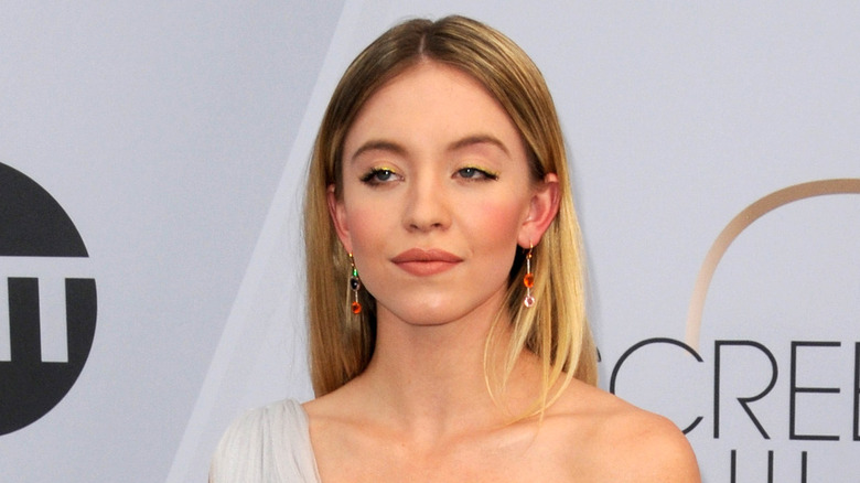 Sydney Sweeney with drop earrings