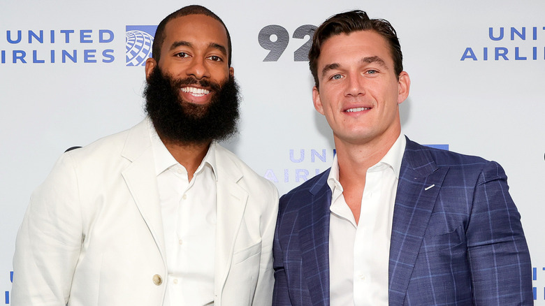 Matt James and Tyler Cameron posing on a red carpet