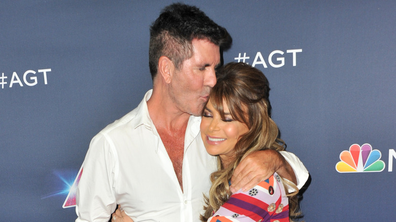 Simon Cowell embracing Paula Abdul