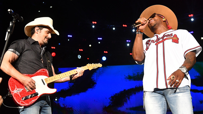 Brad Paisley and Jimmie Allen perform together