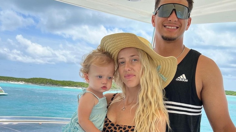 Brittany Mahomes holding daughter