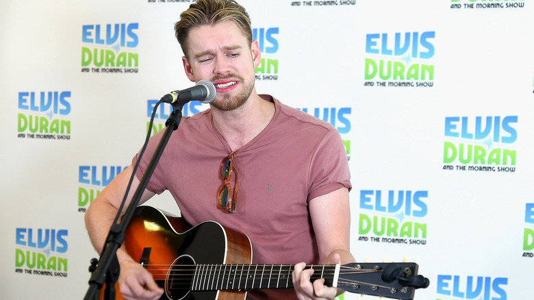 Chord Overstreet playing guitar