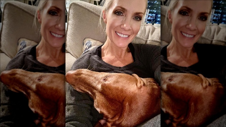 Dana Perino with dog's head in lap