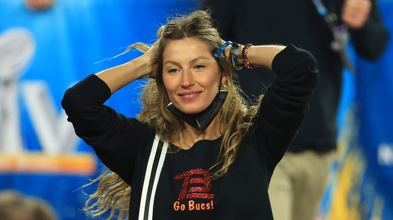 Gisele Bündchen with hands in hair