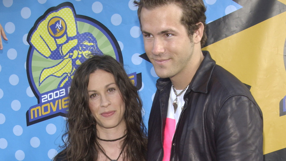 Alanis Morissette and Ryan Reynolds posing together