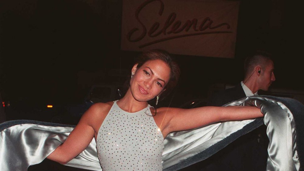 Jennifer Lopez in front of Selena sign