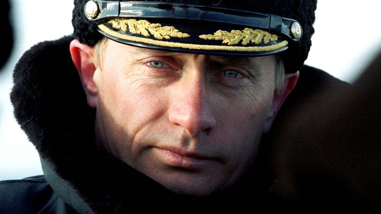 Vladimir Putin posing in navy cap