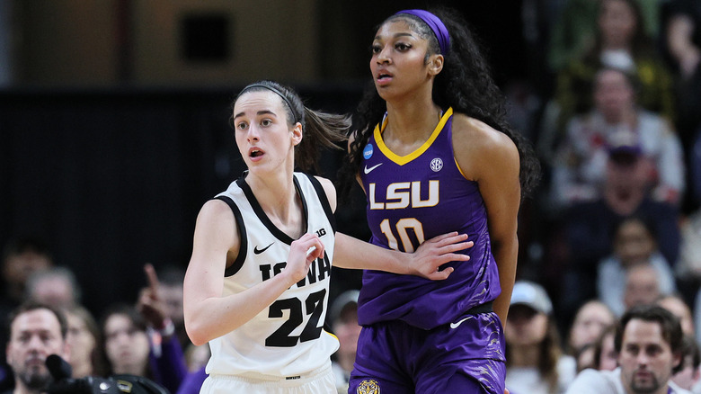 Caitlin Clark and Angel Reese playing basketball