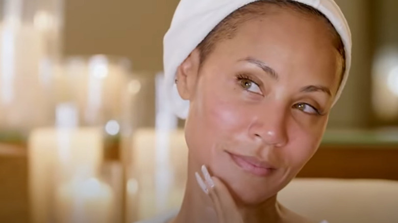 Jada Pinkett Smith touching face