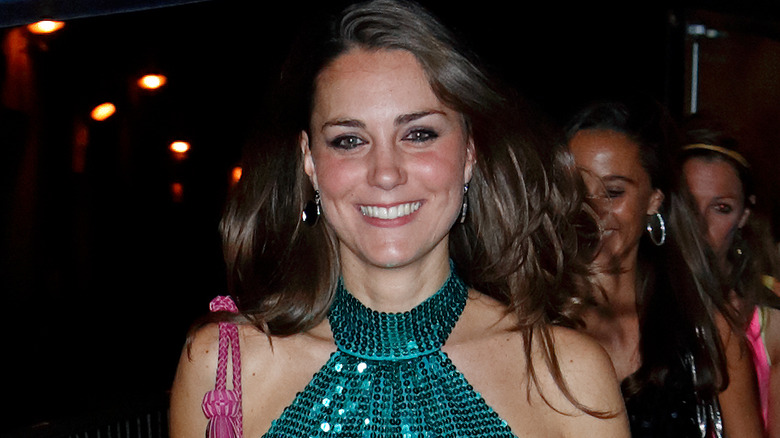 A young Kate Middleton with a green glitter top 