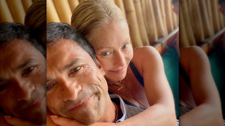 Kelly Ripa hugging Mark Consuelos