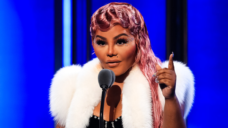 Lil Kim speaking on stage