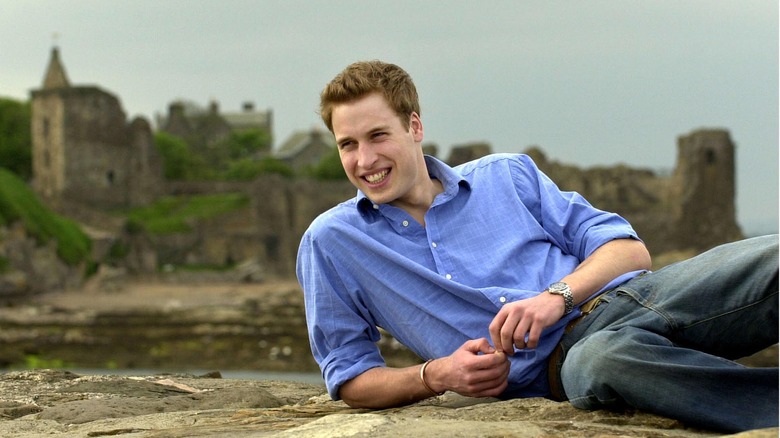 Prince William laying and smiling