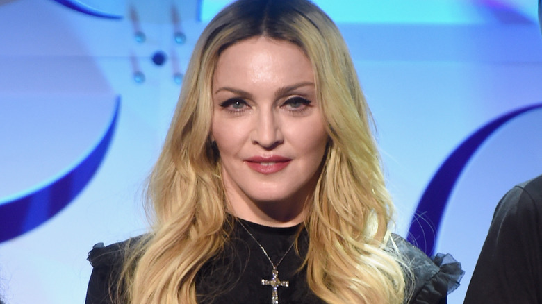 Madonna wearing a crucifix