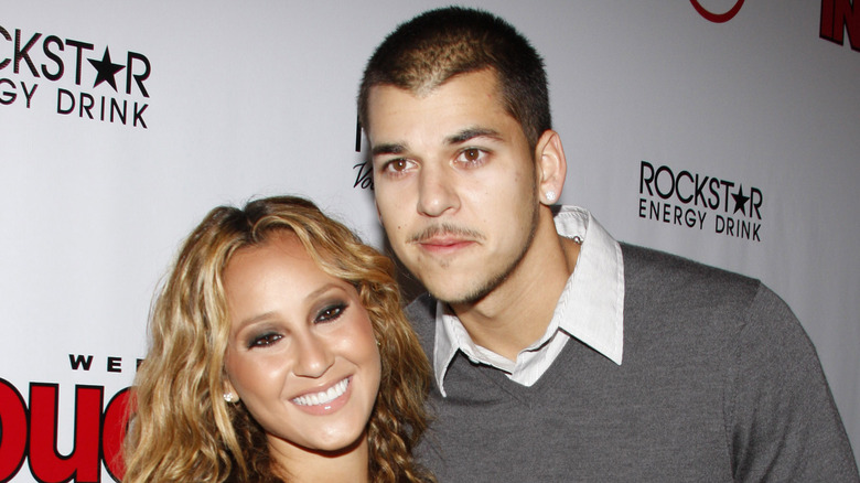 Adrienne Bailon and Rob Kardashian posing