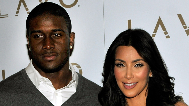 Reggie Bush and Kim Kardashian posing