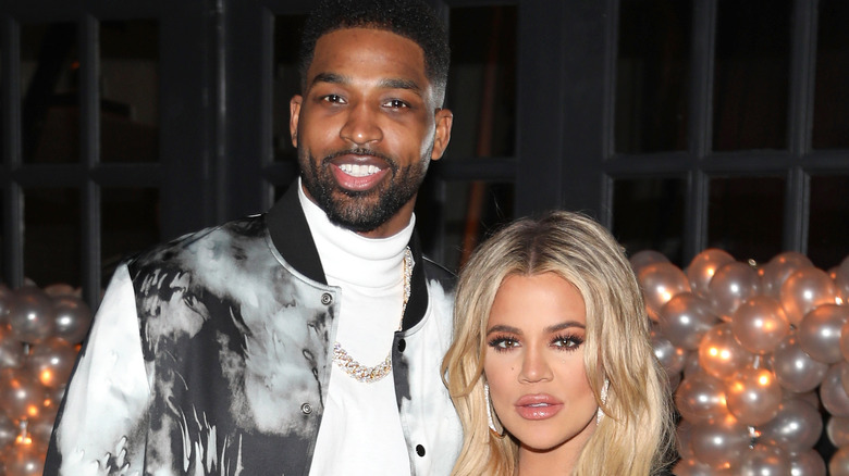 Tristan Thompson and Khloé Kardashian posing