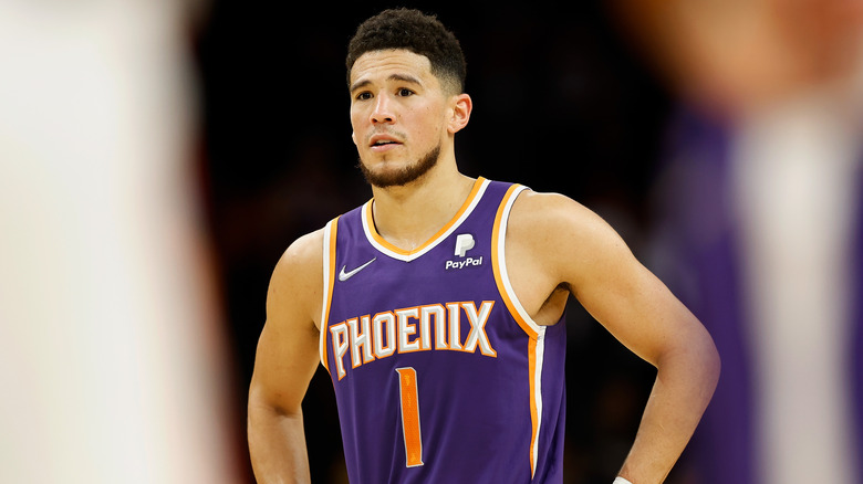 Devin Booker wearing purple jersey