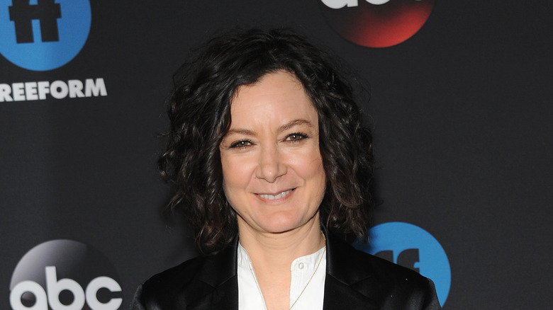 Sara Gilbert smiles