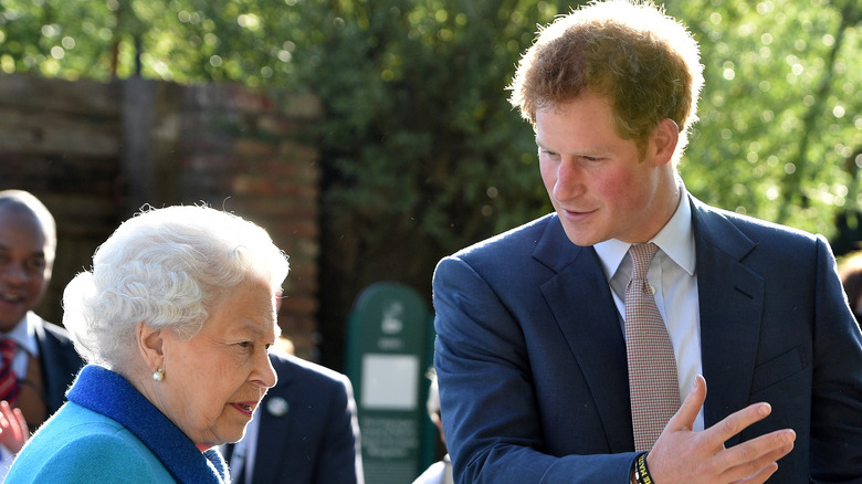 Queen Elizabeth and Prince Harry pose