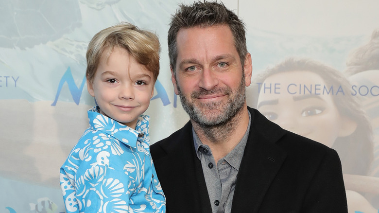 Peter Hermann holding son Andrew Hermann