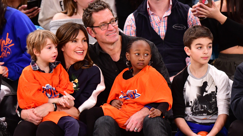 Mariska Hargitay, Peter Hermann, and their kids at a game