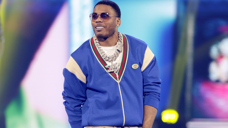 Nelly, wearing a blue jacket