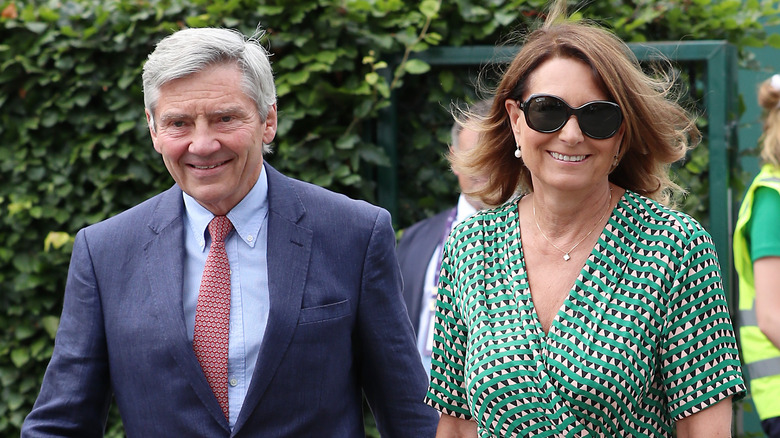 Michael and Carole Middleton walking together and smiling