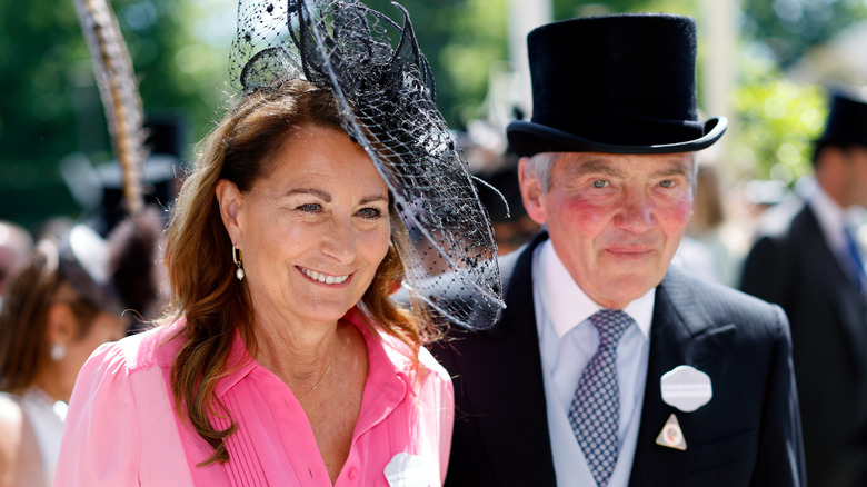 Carole Middleton and Michael Middleton smiling in formal attire