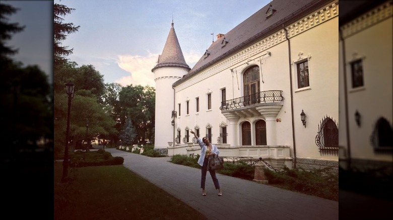 Vanessa Hudgens pointing at castle