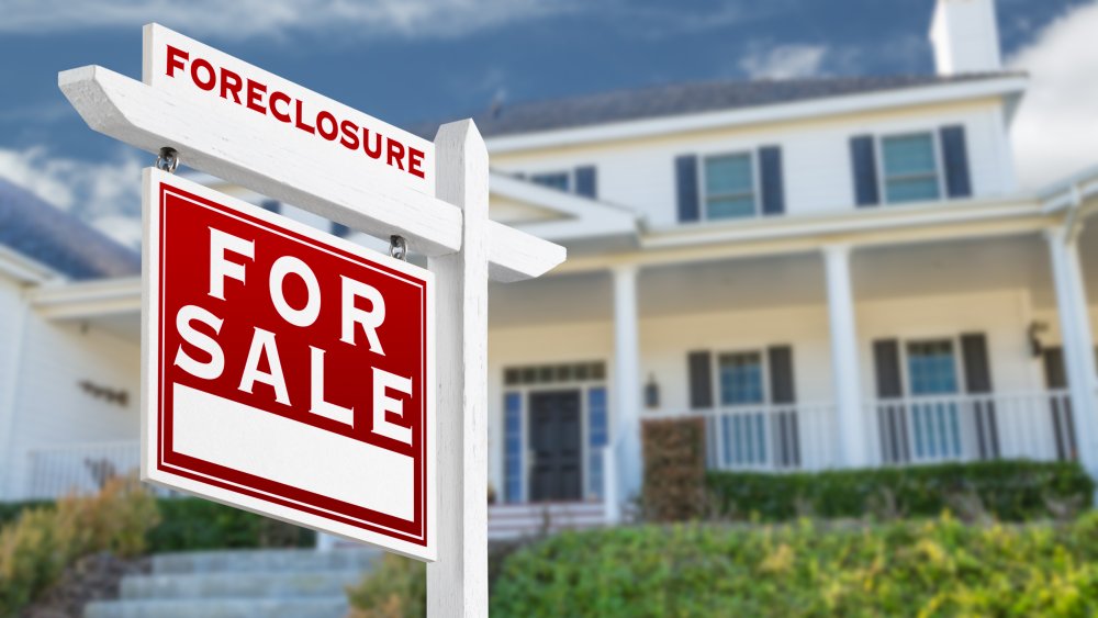 Foreclosure sign in front of a house