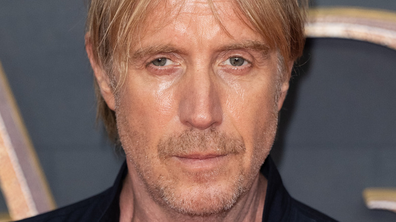 Rhys Ifans looking stern