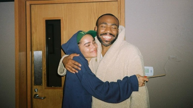 Zoe Kravitz hugging Donald Glover