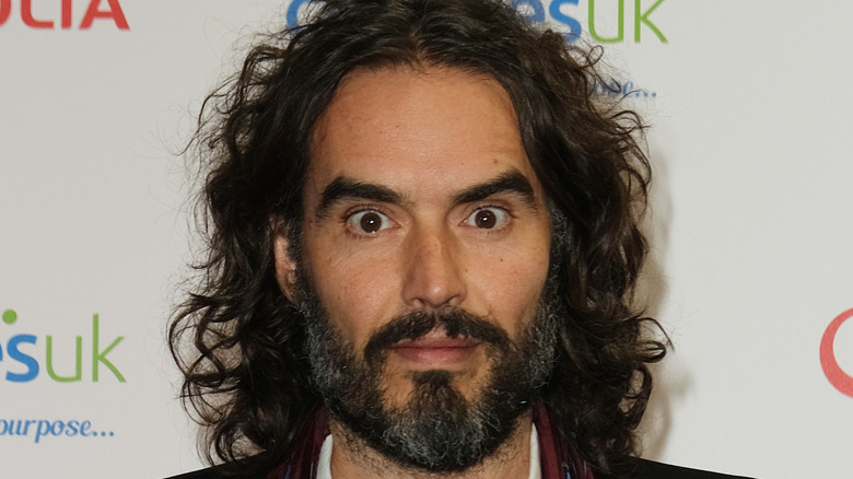 Russell Brand posing