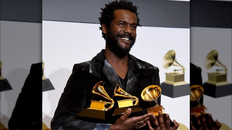 Gary Clark Jr. holding three Grammys