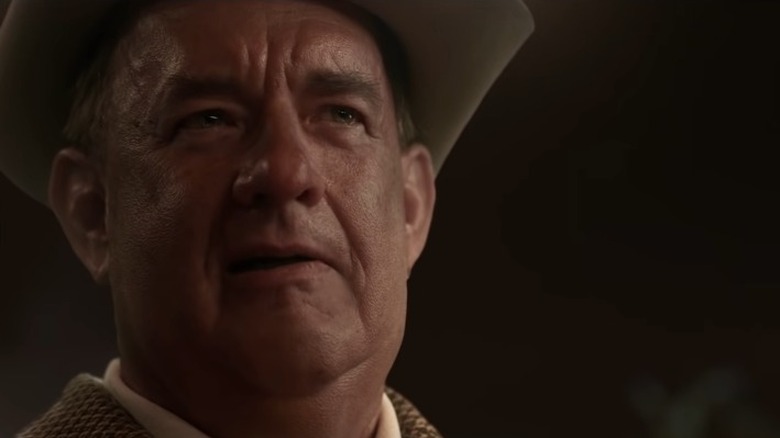 Tom Hanks in Elvis, wearing a cowboy hat