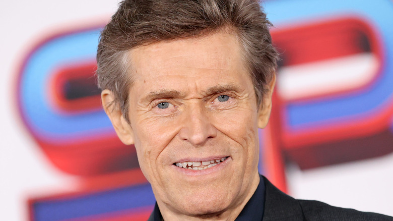 Willem Dafoe smiling