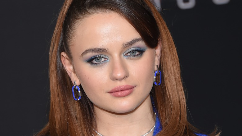 Joey King wears a blue ensemble