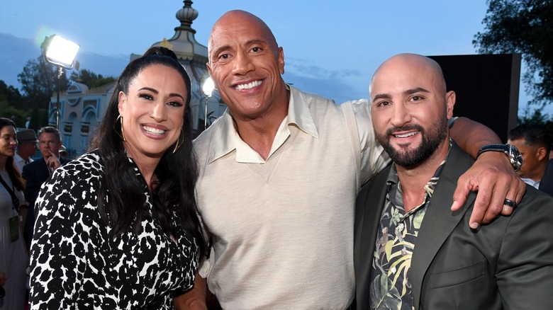 Dany Garcia, Dwayne Johnson, and Dave Rienzi pose