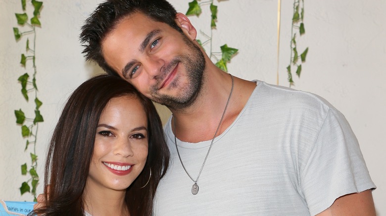 Brant Daugherty and Kim Daugherty pose for a photo