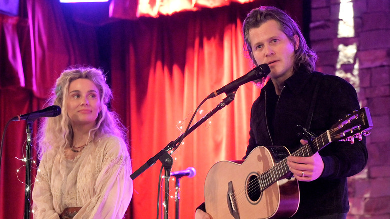 Clare Bowen and Brandon Robert Young performing on stage