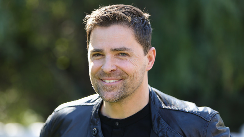 Kavan Smith smiling outdoors